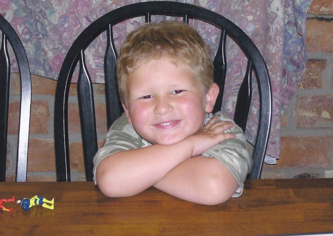 Little Adam at the kitchen table